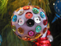 This ball is not entirely covered with sequins, giving it a polka-dot look.